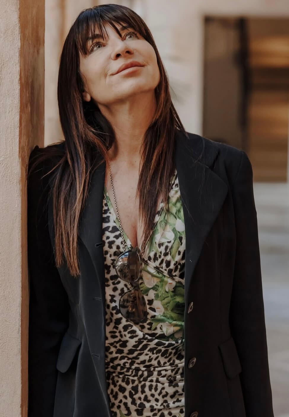 Claudia Elysabeth Babzynsky, the Founder of Almond Souls, a luxury wedding planning brand, standing outdoors in elegant attire.